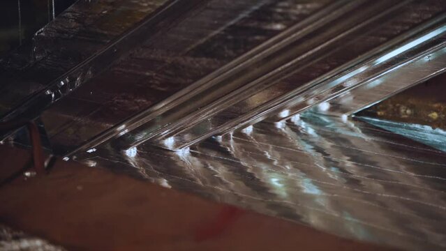 The process of galvanizing metal, the working processes of the hot-dip galvanizing plant, metal production, shooting in slow motion