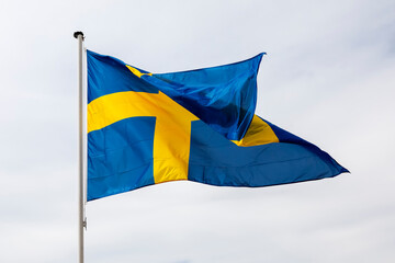 Fototapeta premium Flag of Sweden waving in the wind