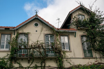Lisbon, Portugal, facade of an old house with windows, European historical buildings, cozy cityscape, Portuguese streets landscape, view of city