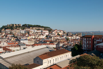 Fototapeta na wymiar Lisbon, Portugal, view of the rooftops and river, European cityscape, view of Portuguese city
