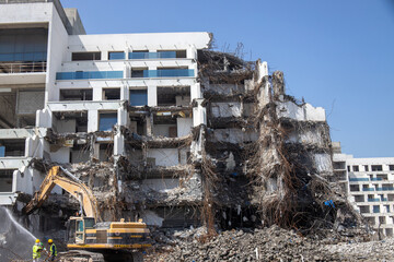 Demolition of old building with debris and steel reinforcement. earthquake and natural disasters