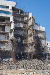 Demolition of old building with debris and steel reinforcement. earthquake and natural disasters