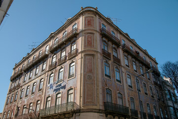 Lisbon, Portugal, facade of an old house with windows, European historical buildings, cozy cityscape, Portuguese streets landscape, view of city