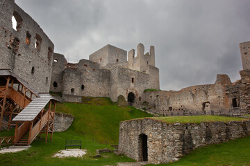 View of a fortified castle in ruins on an overcast day. Low angle shot of the central buildings of...