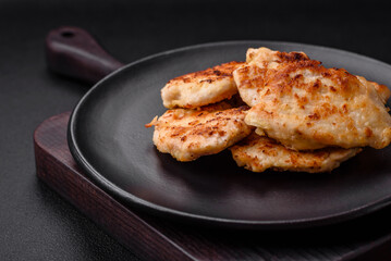 Delicious fried chicken meat chops with spices, salt and herbs