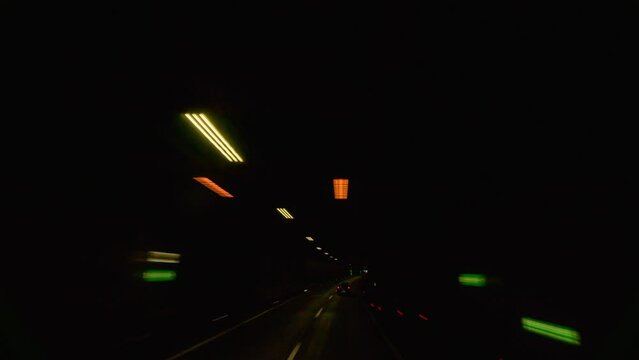 Timelapse of a POV drive on an Austrian mountain highway in autumn, featuring fast-moving traffic, picturesque landscape, and a cloudy sky. Ideal for background or travel scenes.