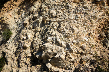 Spring in Yucaipa, California, after a wet winter with the green hills looking at decomposing Granite next to a trail on an eroded Hill