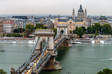 The Széchenyi Chain Bridge is a chain bridge that spans the River Danube between Buda and Pest the western and eastern sides of Budapest, Hungary