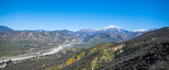 Spring in Yucaipa, California, after a wet winter with the green hills looking at San Gorgonio Mountain from Crafton Hills