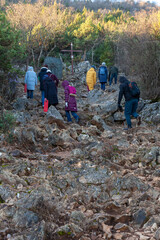 A group of young people climbing Mount Križevac in Medjugorje on a cold February morning. Medjugorje, Bosnia and Herzegovina. 2022/02/11.	