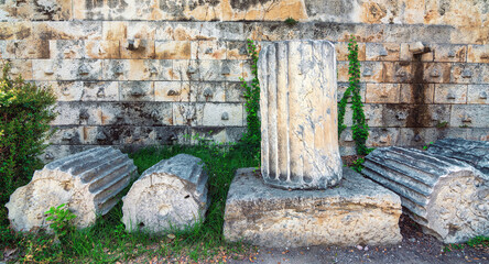 Close-up of a beautiful ancient column located and preserved among the ruins in the Ancient Agora...
