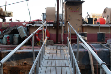 Old rusty barge ladder moored in New York City