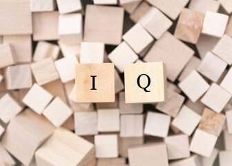 IQ, intelligence concept. Abstract geometric wooden dice IQ icon.  Measure of an individuals...