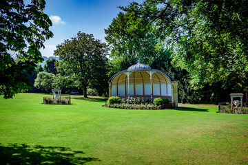 Grassy park with gazebo and trees in Bath England