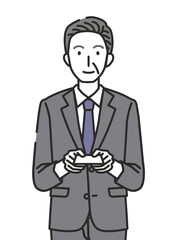 名刺を渡す60代・70代男性