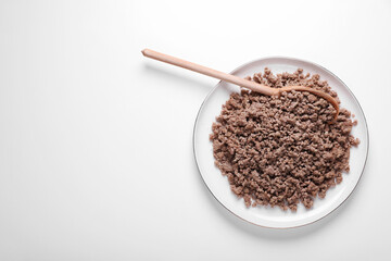 Plate of fried minced meat on white background, top view