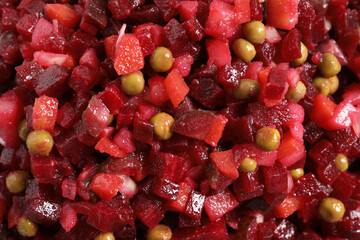 Delicious fresh vinaigrette salad as background, top view