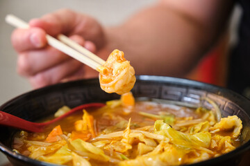 Spicy ramen with prawns, cabbage, bean sprouts, in a japanese restaurant in Kyoto, Japan.
