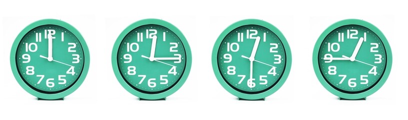 close up of a set of green clocks showing the time; 12, 12.15, 12.30 and 12.45 p.m or a.m. Isolated on white background
 - obrazy, fototapety, plakaty