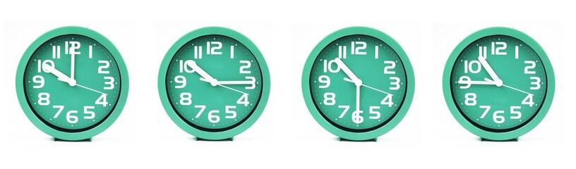 close up of a set of green clocks showing the time; 10, 10.15, 10.30 and 10.45 p.m or a.m. Isolated on white background
 - obrazy, fototapety, plakaty