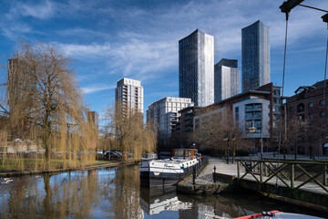 The Bridgewater Canal and Castlefield Basin backed by Manchester skyscrapers, Castlefield, Manchester, England, United Kingdom