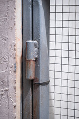 old and rusty Metal hinge on the gate