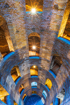 Illuminated view of the bottom of Saint Patrick's well with a spiral staircase, Orvieto, Terni province, Umbria region, Italy