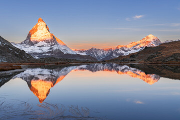 Matterhorn reflection in Riffelsee lake at sunrise, Gornergrat, Zermatt, canton of Valais, Switzerland