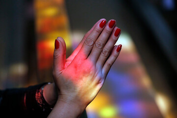 Close up of hands of woman praying in a church, Turckheim, France