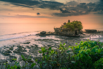View of Tanah Lot, traditional Balinese temple at sunset, Beraban, Kediri, Tabanan Regency, Bali