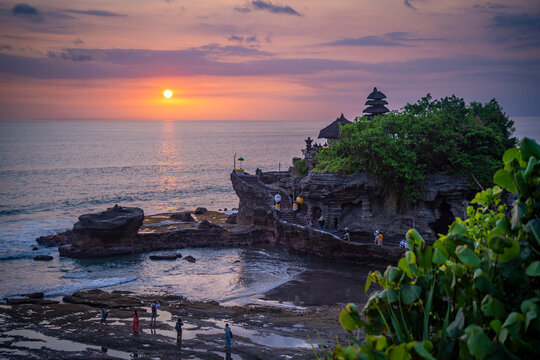 View of Tanah Lot, traditional Balinese temple at sunset, Beraban, Kediri, Tabanan Regency, Bali