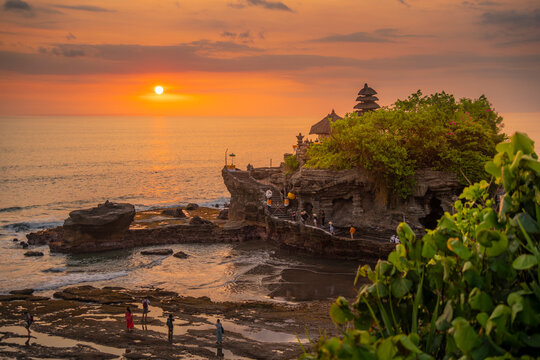 View of Tanah Lot, traditional Balinese temple at sunset, Beraban, Kediri, Tabanan Regency, Bali