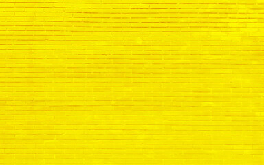 Juicy orange bright brick wall with thick paint layers. Brick wall with only brick silhouette on it. Colorful brick wall pattern, painted bricks as urban texture