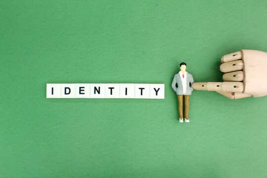 miniature people with the word Identity. the concept of a person's identity or a company's identity.