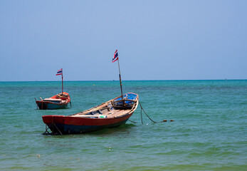 landscape look view point Small fishing boat wooden parked coast sea beach. after fishing of...