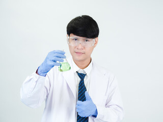 Asian male student scientist in reagent mixing laboratory In a science research laboratory with...