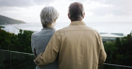 Love, back and senior couple on a balcony enjoying the outdoor view while on a holiday or vacation....