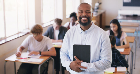 Portrait, black man and teacher in a class, students and smile with knowledge, education and development. Face, male person and educator with a test, exam or learning in a school, happiness or growth