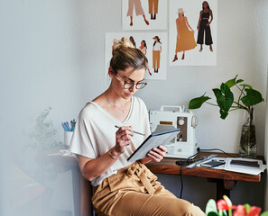 Fashion, woman and designer with a tablet, workshop and typing with startup success, planning and...