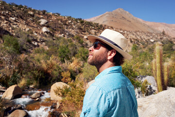 portrait mid adult caucasian male contemplating the beauty of the landscape in Elqui Valley