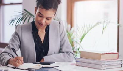 Business woman, calculator and writing in notebook on desk for finance budget, accounting or planning. Female admin accountant with books, pen and list for tax on financial profit or income in office