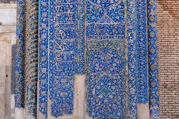 Tiles on wall at entrance of Blue Mosque in Tabriz, Iran. Constructed in 1465 and severely damaged by earthquake in 1780. Masterpiece of Azeri architecture. Historic heritage and tourist attraction. - obrazy, fototapety, plakaty