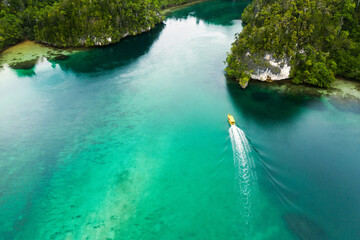 Travel, top view and boat on island river for adventure, holiday and vacation in Mauritius. Nature,...