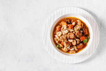 french cassoulet of chicken, sausages, white beans