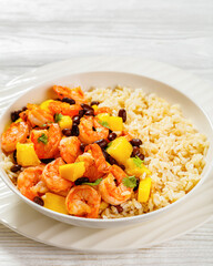 shrimps with beans, mango, brown rice in bowl