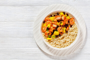 shrimps with beans, mango, brown rice in bowl