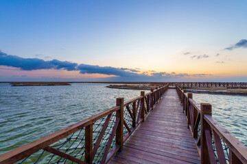 wooden pier at sunset