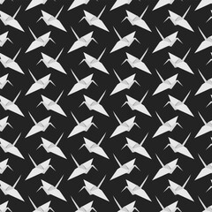 Seamless origami pattern on a dark background. Paper crane. Flat style vector image