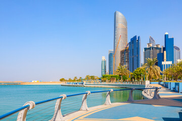 View of Abu Dhabi with sea, beach and skyscrapers. Travel in UAE