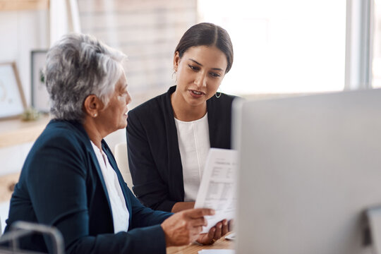 Mentor, coaching or business women with documents talking, speaking or planning project in office. Paperwork, teamwork collaboration or senior manager reading with intern for administration training